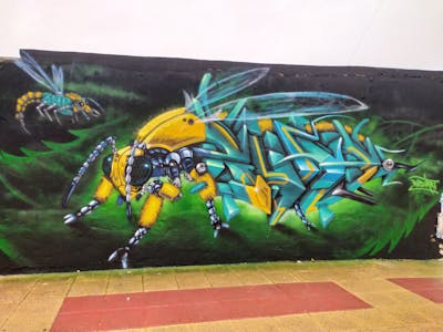 Yellow and Cyan Characters by Rudiart. This Graffiti is located in Murcia, Spain and was created in 2022. This Graffiti can be described as Characters and 3D.