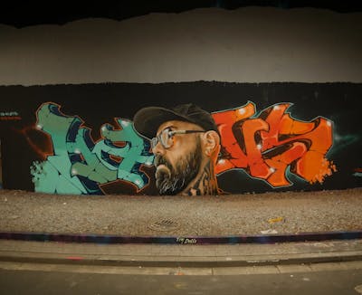 Orange and Cyan Stylewriting by Mister Oreo and HAUS. This Graffiti is located in bochum, Germany and was created in 2022. This Graffiti can be described as Stylewriting, Characters and Wall of Fame.
