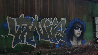 Green and Beige and Blue Stylewriting by Tonik and Napas crew. This Graffiti is located in Moscow, Russian Federation and was created in 2023. This Graffiti can be described as Stylewriting, Characters and Abandoned.