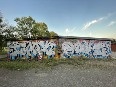 Chrome and Colorful Stylewriting by Twis and Fumok. This Graffiti is located in Germany and was created in 2022. This Graffiti can be described as Stylewriting and Wall of Fame.