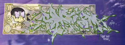 Beige and Green Stylewriting by SAO2971. This Graffiti is located in St helier, United Kingdom and was created in 2024. This Graffiti can be described as Stylewriting, Characters and Streetart.
