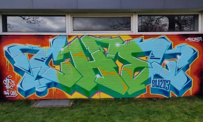 Light Green and Light Blue and Orange Stylewriting by CHE. This Graffiti is located in Jülich, Germany and was created in 2024. This Graffiti can be described as Stylewriting and Wall of Fame.