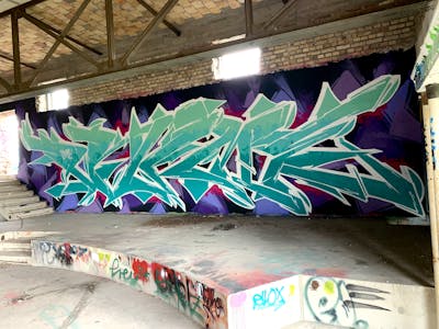 Cyan and Violet and White Stylewriting by Prime. This Graffiti is located in Germany and was created in 2023. This Graffiti can be described as Stylewriting and Abandoned.