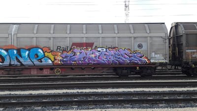 Violet and Colorful Stylewriting by DCK, Angel and ALL CAPS COLLECTIVE. This Graffiti is located in Hungary and was created in 2019. This Graffiti can be described as Stylewriting, Trains and Freights.