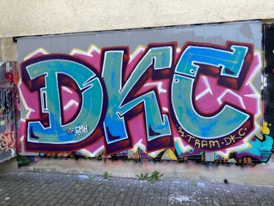 Colorful and Light Blue Stylewriting by Dkc and Tram. This Graffiti is located in Konstanz, Germany and was created in 2022.