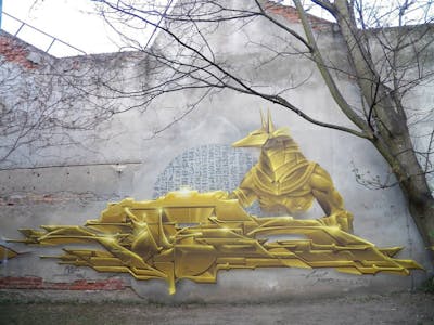 Gold Stylewriting by Köter. This Graffiti is located in Leipzig, Germany and was created in 2020. This Graffiti can be described as Stylewriting, Futuristic and Characters.