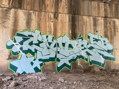 Light Blue and Cyan and Light Green Stylewriting by Crude. This Graffiti is located in Bangkok, Thailand and was created in 2023. This Graffiti can be described as Stylewriting and Abandoned.