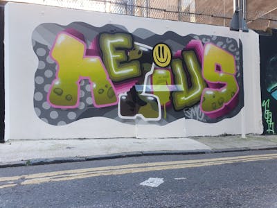 Grey and Light Green and Coralle Stylewriting by Nelius and smo__crew. This Graffiti is located in London, United Kingdom and was created in 2022. This Graffiti can be described as Stylewriting and Wall of Fame.