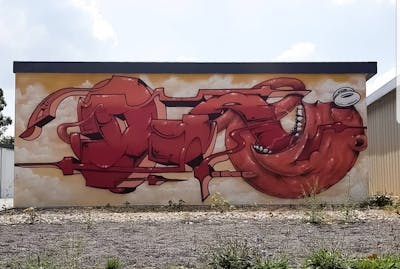 Red and Beige Stylewriting by Diro, dwscrew, ink and hellboys. This Graffiti is located in Halle/Saale, Germany and was created in 2021.