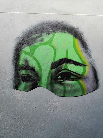 Light Green Characters by Dutek pacheco. This Graffiti is located in Playa del Carmen, Mexico and was created in 2021.