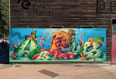 Colorful and Light Green Characters by Abys. This Graffiti is located in Epinal, France and was created in 2022. This Graffiti can be described as Characters, Streetart, Murals and Stylewriting.