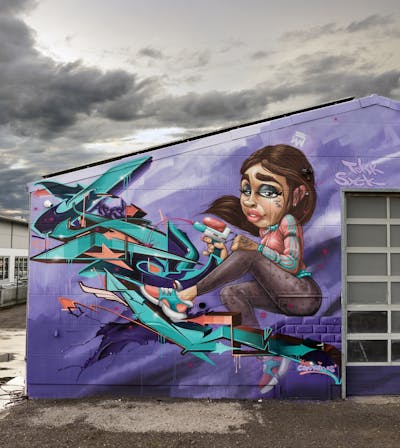 Violet and Cyan Stylewriting by Syck and Tokk. This Graffiti is located in Germany and was created in 2023. This Graffiti can be described as Stylewriting, Characters, Murals and Streetart.