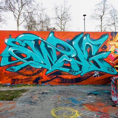 Red and Cyan Stylewriting by Swing, MCT and WBC. This Graffiti is located in Lyon, France and was created in 2022. This Graffiti can be described as Stylewriting and Wall of Fame.