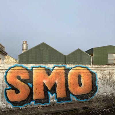 Orange and Black Stylewriting by smo__crew. This Graffiti is located in London, United Kingdom and was created in 2019. This Graffiti can be described as Stylewriting and Street Bombing.