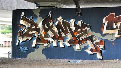 Beige and Brown Stylewriting by RAME. This Graffiti is located in Oldenburg, Germany and was created in 2023. This Graffiti can be described as Stylewriting and Wall of Fame.