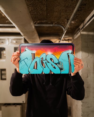 Light Blue and Colorful Canvas by TOESER ONE. This Graffiti is located in Hamburg, Germany and was created in 2024. This Graffiti can be described as Canvas.