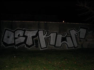Chrome and Black Stylewriting by urine, OST, KCF and mobar. This Graffiti is located in Wolfen, Germany and was created in 2008. This Graffiti can be described as Stylewriting and Street Bombing.