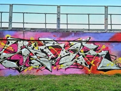 Chrome and Colorful Stylewriting by SIDOK. This Graffiti is located in London, United Kingdom and was created in 2022. This Graffiti can be described as Stylewriting and Wall of Fame.