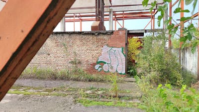 Cyan and White Handstyles by 7AM. This Graffiti is located in Novi Sad, Serbia and was created in 2022. This Graffiti can be described as Handstyles and Abandoned.