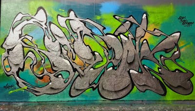 Chrome and Light Green Stylewriting by SIDOK. This Graffiti is located in London, United Kingdom and was created in 2022. This Graffiti can be described as Stylewriting and Wall of Fame.