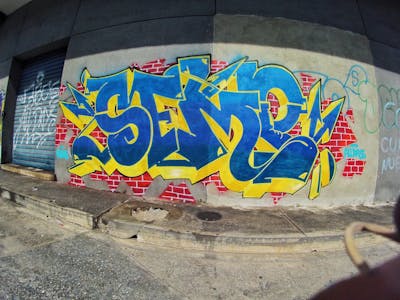 Light Blue and Yellow Stylewriting by Semp. This Graffiti is located in Venezuela and was created in 2023.