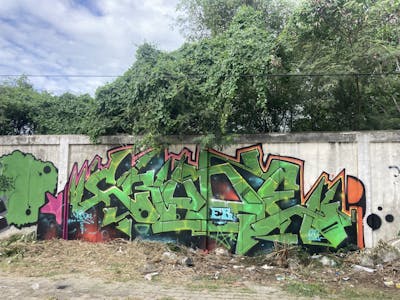 Light Green Stylewriting by Crude and EB. This Graffiti is located in Bangkok, Thailand and was created in 2022. This Graffiti can be described as Stylewriting and Abandoned.