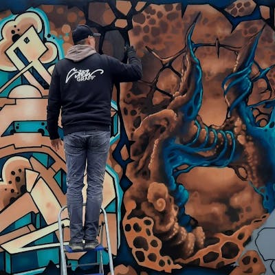 Brown and Cyan Stylewriting by Shew and the Buddys. This Graffiti is located in Strausberg, Germany and was created in 2022.