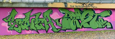 Green and Coralle Stylewriting by SEWER and Beast. This Graffiti is located in Würzburg, Germany and was created in 2022. This Graffiti can be described as Stylewriting and Wall of Fame.