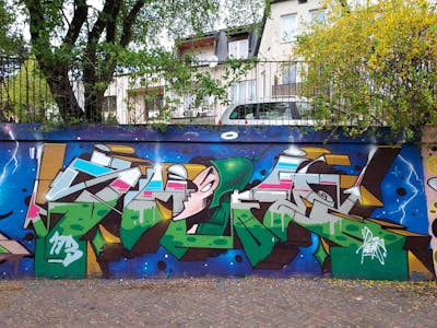 Colorful and Green Stylewriting by Fems173. This Graffiti is located in lublin, Poland and was created in 2023. This Graffiti can be described as Stylewriting, Characters and Wall of Fame.