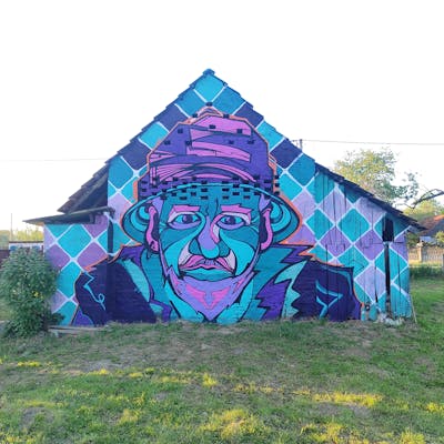 Cyan and Violet Characters by SMOKI. This Graffiti is located in Legrad, Croatia and was created in 2023. This Graffiti can be described as Characters, Streetart and Murals.