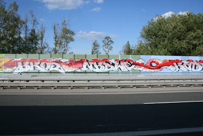 White and Coralle and Red Stylewriting by bros, NBSWE, RADICALS, rizok and R120K. This Graffiti is located in Leipzig, Germany and was created in 2020. This Graffiti can be described as Stylewriting, Street Bombing and Characters.
