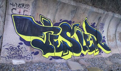 Yellow and Blue Stylewriting by Tesla. This Graffiti is located in Sotschi, Russian Federation and was created in 2017. This Graffiti can be described as Stylewriting and Abandoned.