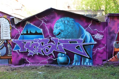 Violet and Light Blue Stylewriting by Tesla. This Graffiti is located in Saint-Petersburg, Russian Federation and was created in 2021. This Graffiti can be described as Stylewriting and Characters.