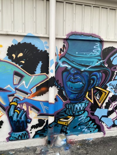 Cyan and Blue Characters by Mons and TWDC. This Graffiti is located in Bangkok, Thailand and was created in 2023.