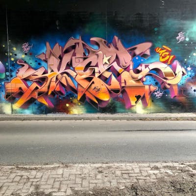 Colorful and Orange Stylewriting by Skore79. This Graffiti is located in Wilhelmshaven, Germany and was created in 2021. This Graffiti can be described as Stylewriting and Wall of Fame.