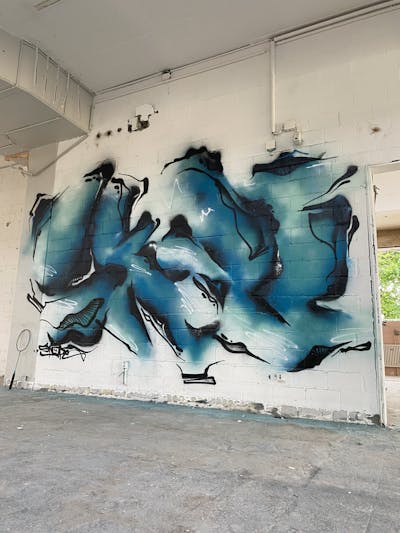 Cyan and Black Stylewriting by SKOPE. This Graffiti is located in Biel/Bienne, Switzerland and was created in 2023. This Graffiti can be described as Stylewriting and Abandoned.