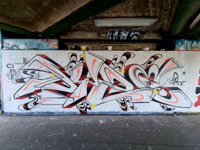 White and Red and Black Stylewriting by Dyze. This Graffiti is located in Bern, Switzerland and was created in 2023. This Graffiti can be described as Stylewriting and Wall of Fame.