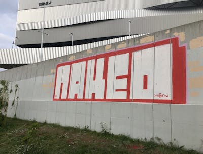 Red and White Roll Up by Naked. This Graffiti is located in Budapest, Hungary and was created in 2023.