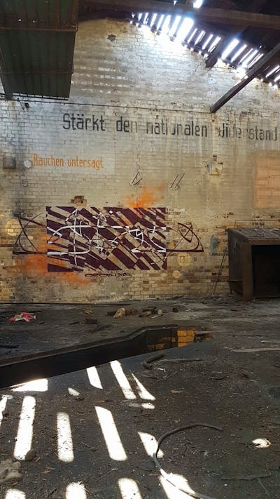 Brown Handstyles by urine and OST. This Graffiti is located in Köthen, Germany and was created in 2020. This Graffiti can be described as Handstyles and Abandoned.
