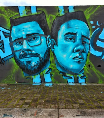 Light Blue and Colorful Characters by Bfive. This Graffiti is located in Porto, Portugal and was created in 2021.