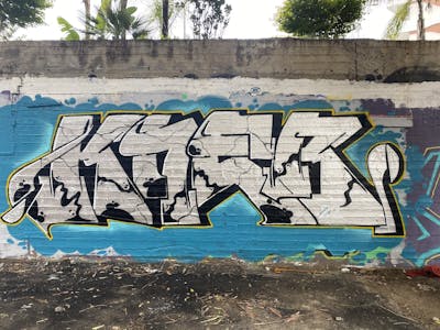Light Blue and Chrome Stylewriting by KNEB. This Graffiti is located in Cyprus and was created in 2022. This Graffiti can be described as Stylewriting and Wall of Fame.