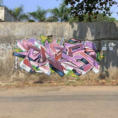 Coralle and White Street Bombing by Danzerten. This Graffiti is located in Pekalongan, Indonesia and was created in 2022. This Graffiti can be described as Street Bombing and Stylewriting.