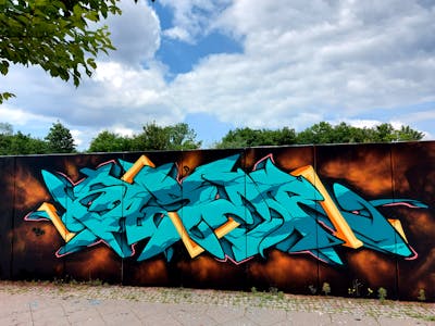 Cyan and Colorful Stylewriting by KASER and N3M crew. This Graffiti is located in Berlin, Germany and was created in 2021. This Graffiti can be described as Stylewriting and Wall of Fame.