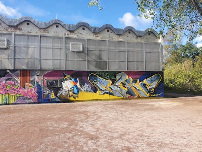 Colorful and Yellow Stylewriting by scare and seka. This Graffiti is located in Erfurt, Germany and was created in 2022. This Graffiti can be described as Stylewriting, Characters and Wall of Fame.