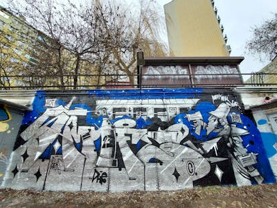 Chrome and Blue and Black Stylewriting by Fems173. This Graffiti is located in lublin, Poland and was created in 2023. This Graffiti can be described as Stylewriting, Characters and Wall of Fame.