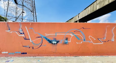 Orange and Light Blue Stylewriting by Vino AAA. This Graffiti is located in Essex, United Kingdom and was created in 2022. This Graffiti can be described as Stylewriting, Futuristic and Wall of Fame.