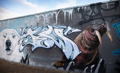 Light Blue and White and Brown Stylewriting by Saf One and Cors One. This Graffiti is located in Berlin, Germany and was created in 2023. This Graffiti can be described as Stylewriting, Characters and Wall of Fame.