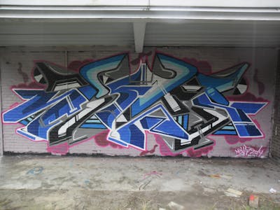 Grey and Light Blue Stylewriting by News. This Graffiti is located in Tilburg, Netherlands and was created in 2014. This Graffiti can be described as Stylewriting and Wall of Fame.