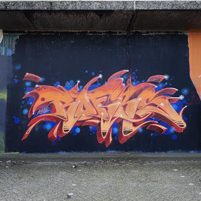 Orange and Blue and Red Stylewriting by Fiks, MicRoFiks and Rofiks. This Graffiti is located in Oldenburg, Germany and was created in 2023. This Graffiti can be described as Stylewriting and Wall of Fame.