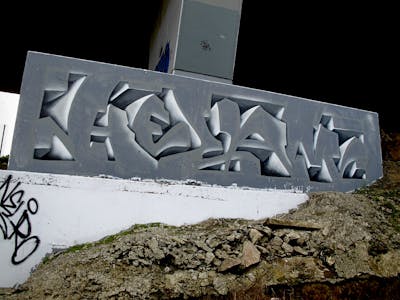 Grey Stylewriting by Kezam. This Graffiti is located in Auckland, New Zealand and was created in 2022. This Graffiti can be described as Stylewriting and 3D.